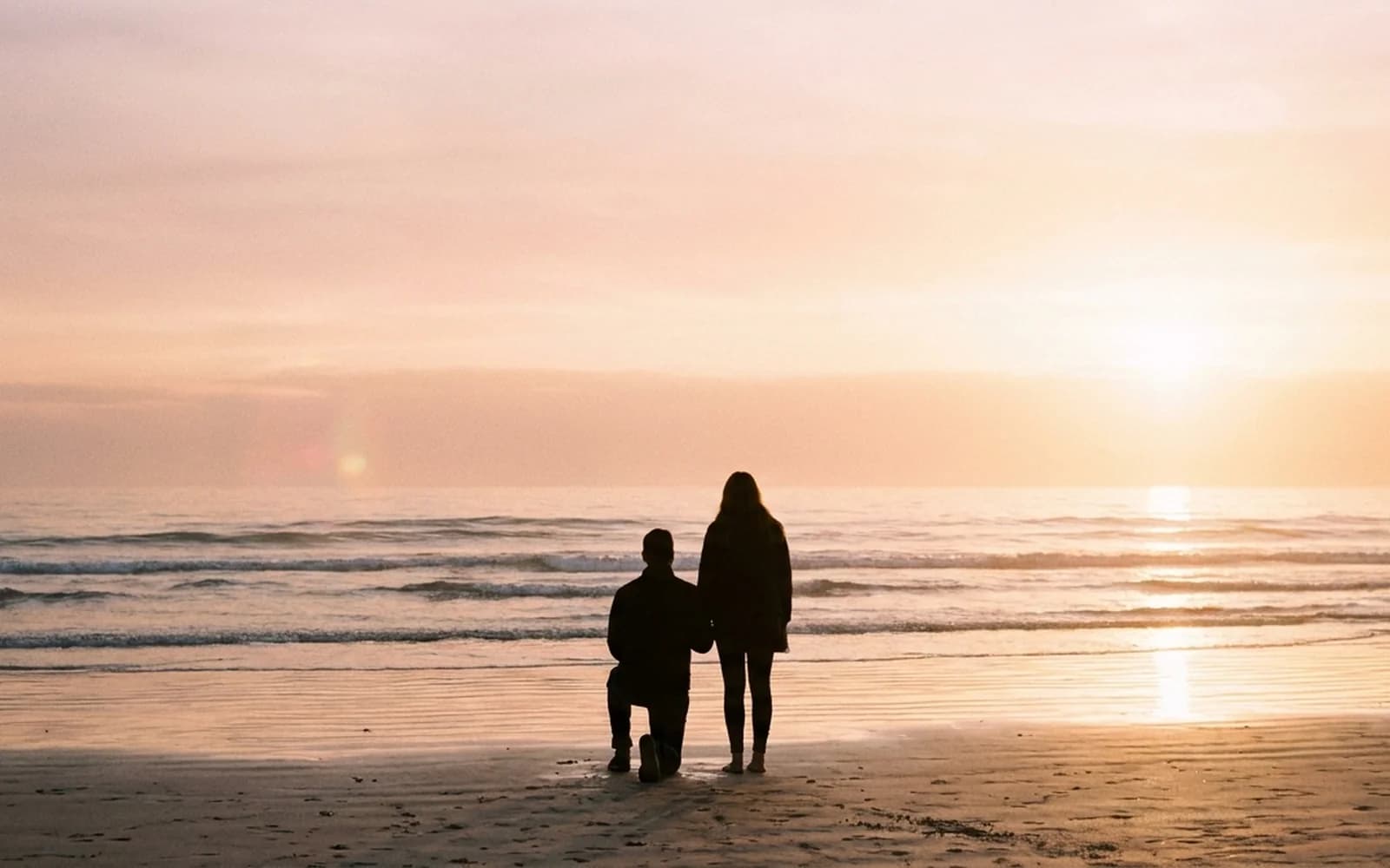 A sunset bayside proposal silhouette near Melbourne